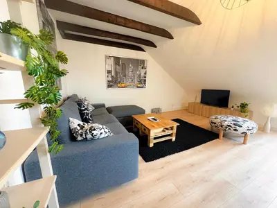 Coin salon dans l'établissement Le Penthouse Quimper Gare & Centre Ville