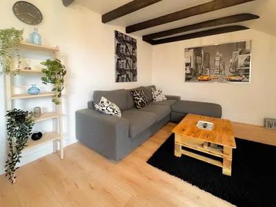 Coin salon dans l'établissement Le Penthouse Quimper Gare & Centre Ville