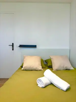 Un ou plusieurs lits dans un hébergement de l'établissement Le Ponant - Appartement 3 chambres cosy et lumineux