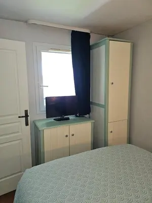 Un ou plusieurs lits dans un hébergement de l'établissement Le cosy des Sables Blancs