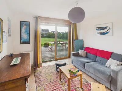 Coin salon dans l'établissement Superbe maison pour 8 avec jardin - Vue mer