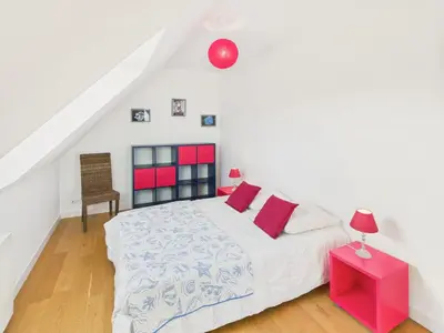 Un ou plusieurs lits dans un hébergement de l'établissement Superbe maison pour 8 avec jardin - Vue mer
