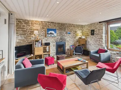 Coin salon dans l'établissement Superbe maison pour 8 avec jardin - Vue mer
