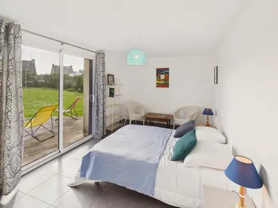 Un ou plusieurs lits dans un hébergement de l'établissement Superbe maison pour 8 avec jardin - Vue mer