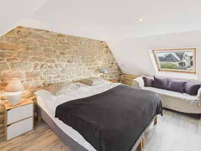 Un ou plusieurs lits dans un hébergement de l'établissement Charmante maison pour 6 à 900m de la plage