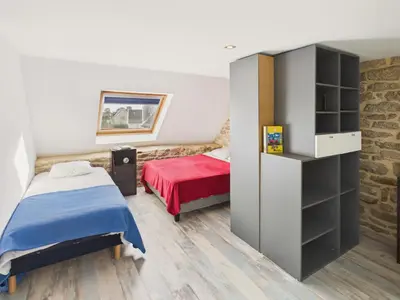 Un ou plusieurs lits dans un hébergement de l'établissement Charmante maison pour 6 à 900m de la plage