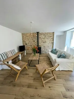 Coin salon dans l'établissement Family Stone House In Pays Bigouden