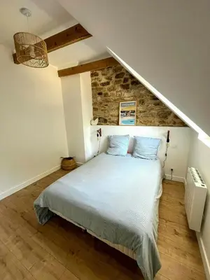 Un ou plusieurs lits dans un hébergement de l'établissement Family Stone House In Pays Bigouden