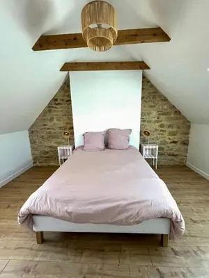 Un ou plusieurs lits dans un hébergement de l'établissement Family Stone House In Pays Bigouden