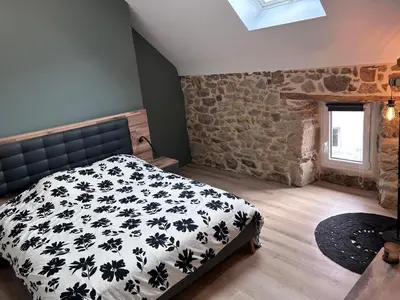 Un ou plusieurs lits dans un hébergement de l'établissement Maison en pierre - ancien corps de ferme