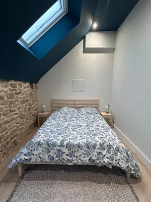 Un ou plusieurs lits dans un hébergement de l'établissement Maison en pierre - ancien corps de ferme