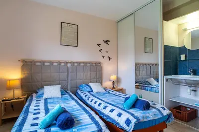 Un ou plusieurs lits dans un hébergement de l'établissement La Villa de Pentrez -A quelques mètres de la plage