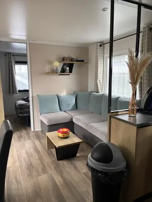Coin salon dans l'établissement Mobil Home 40 m2 3 chambres