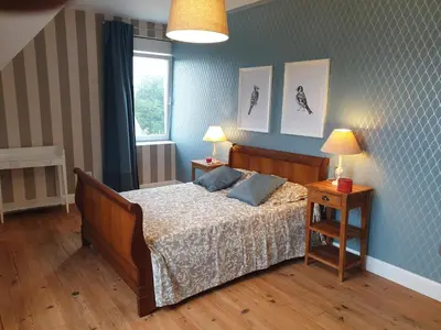 Un ou plusieurs lits dans un hébergement de l'établissement La Maison d'Adonis avec jacuzzi à Telgruc sur Mer