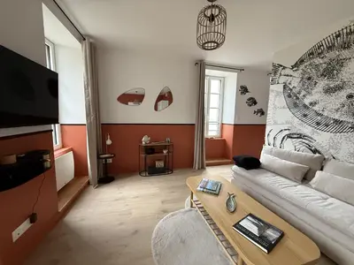 Télévision ou salle de divertissement dans l'établissement Au Poisson Perche