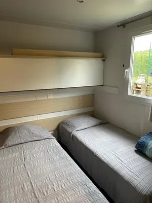 Un ou plusieurs lits dans un hébergement de l'établissement Mobil-home 1