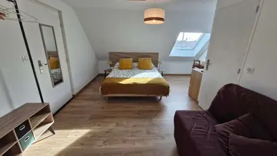 Un ou plusieurs lits dans un hébergement de l'établissement Chambre confortable chez Isabelle
