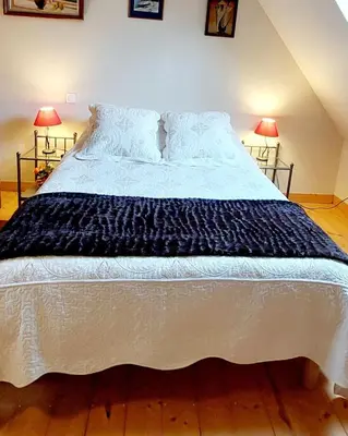 Un ou plusieurs lits dans un hébergement de l'établissement Ti Ar Skol, chambre d'hôtes