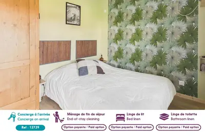 Un ou plusieurs lits dans un hébergement de l'établissement Charmant gîte pour 2 avec jardin