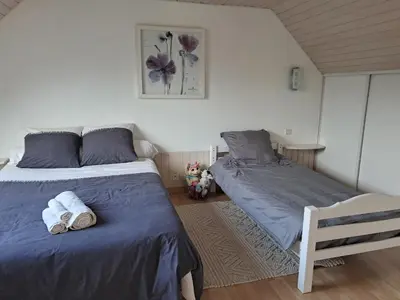 Un ou plusieurs lits dans un hébergement de l'établissement Gîte nature et mer, proche Brest et abers