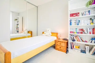 Un ou plusieurs lits dans un hébergement de l'établissement Belle maison avec jardin & espace d'hiver