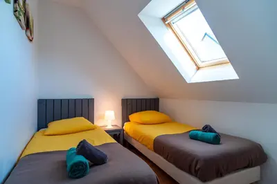 Un ou plusieurs lits dans un hébergement de l'établissement Pentrez Cottage - 600m de la Plage