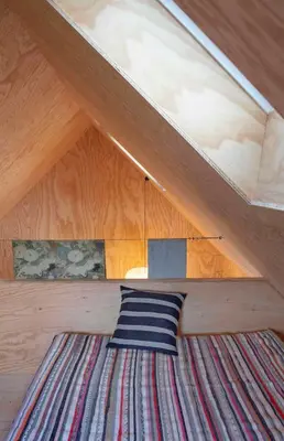 Un ou plusieurs lits dans un hébergement de l'établissement Wooden Cabin Facing The Sea