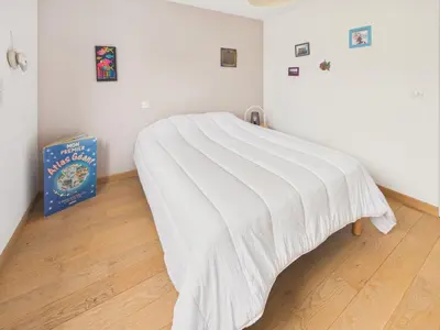 Un ou plusieurs lits dans un hébergement de l'établissement Jolie maison pour 6 avec jardin en plein centre