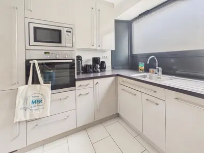 Cuisine ou kitchenette dans l'établissement Jolie maison pour 6 avec jardin en plein centre