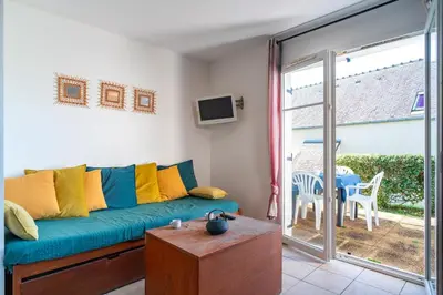 Coin salon dans l'établissement Saint-Nic Cottage - 600 m de la plage