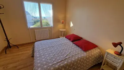 Un ou plusieurs lits dans un hébergement de l'établissement Grande maison lumineuse avec vue mer à Locquémeau