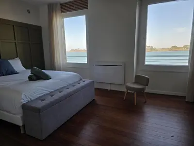 Un ou plusieurs lits dans un hébergement de l'établissement appartement confortable avec magnifique vue mer