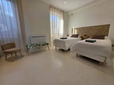 Un ou plusieurs lits dans un hébergement de l'établissement appartement confortable avec magnifique vue mer