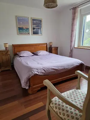 Un ou plusieurs lits dans un hébergement de l'établissement Maison bretonne face a la plage de la Greve Blanche