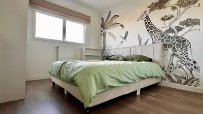 Un ou plusieurs lits dans un hébergement de l'établissement Maison ROSCOFF avec vue mer