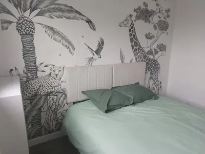 Un ou plusieurs lits dans un hébergement de l'établissement Maison ROSCOFF avec vue mer