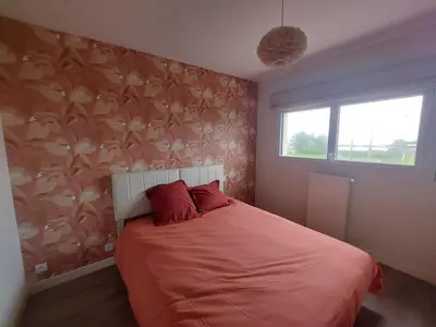 Un ou plusieurs lits dans un hébergement de l'établissement Maison ROSCOFF avec vue mer