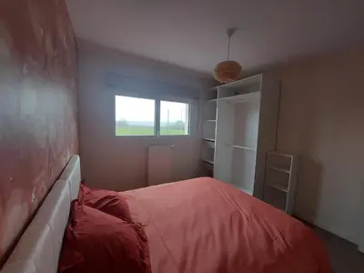 Un ou plusieurs lits dans un hébergement de l'établissement Maison ROSCOFF avec vue mer