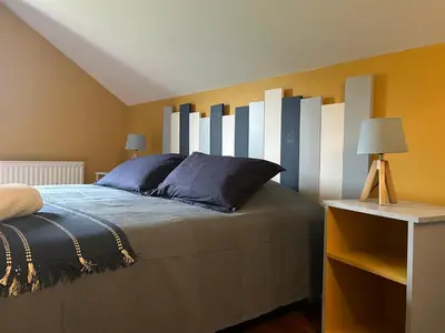 Un ou plusieurs lits dans un hébergement de l'établissement Le Cottage du Cap