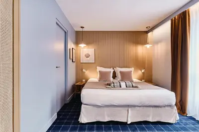 Un ou plusieurs lits dans un hébergement de l'établissement Hôtel de la Mer & Spa