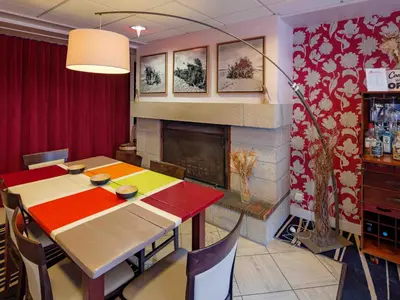 Coin salon dans l'établissement Hôtel La Résidence