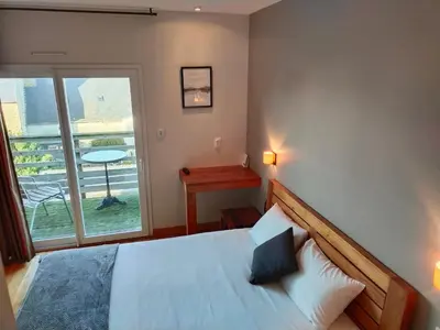 Un ou plusieurs lits dans un hébergement de l'établissement Hotel Au Bout Du Monde