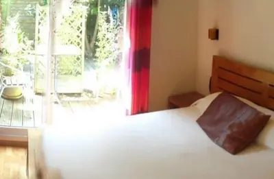 Un ou plusieurs lits dans un hébergement de l'établissement Hotel Au Bout Du Monde
