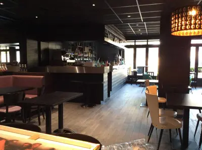Coin salon dans l'établissement Le Relais De La Place