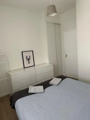 Un ou plusieurs lits dans un hébergement de l'établissement Appartement Design III - Port du Rosmeur - Parking Privé - Douarnenez