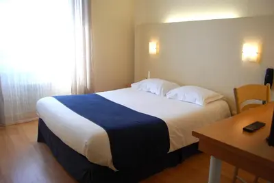 Un ou plusieurs lits dans un hébergement de l'établissement Le Bretagne - Hôtel