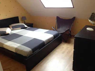 Un ou plusieurs lits dans un hébergement de l'établissement Duplex proche plage et centre ville