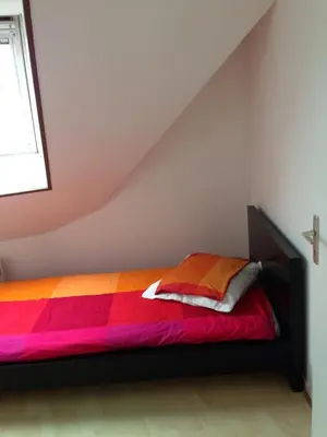 Un ou plusieurs lits dans un hébergement de l'établissement Duplex proche plage et centre ville