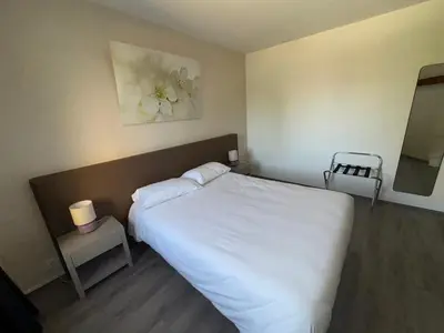 Un ou plusieurs lits dans un hébergement de l'établissement Hôtel Dupleix - Hyper centre - Réouverture