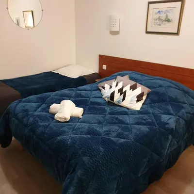 Un ou plusieurs lits dans un hébergement de l'établissement Hotel Restaurant Les Oceanides